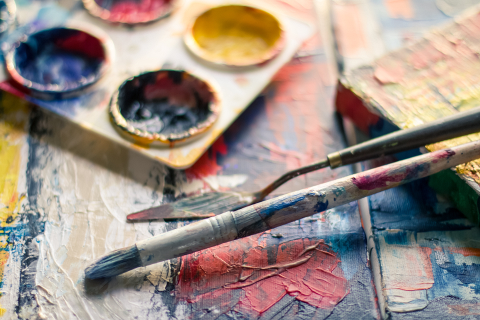 An artist's palette, knife and brush in the studio
